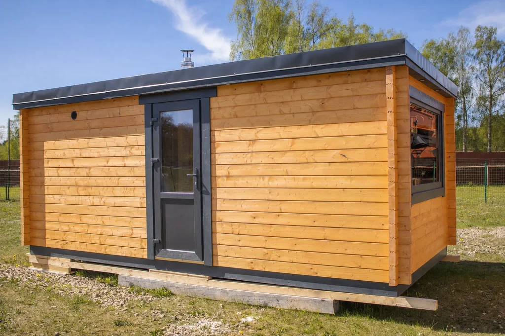 LIELĀ outdoor sauna exterior with the entrance door open